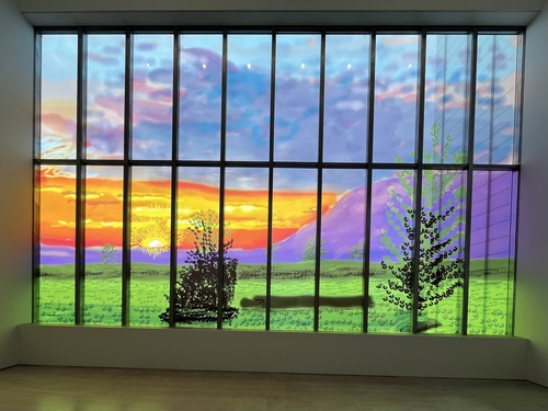 David Hockney's Sunley Window 2026 at Turner Contemporary, a vivid iPad-drawn sunset landscape filling a large gallery window, with coloured light spilling onto the floor