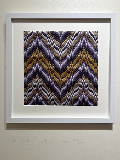 Framed Bargello needlework in purple, gold and white zigzag, inspired by a portrait of Susan Villiers