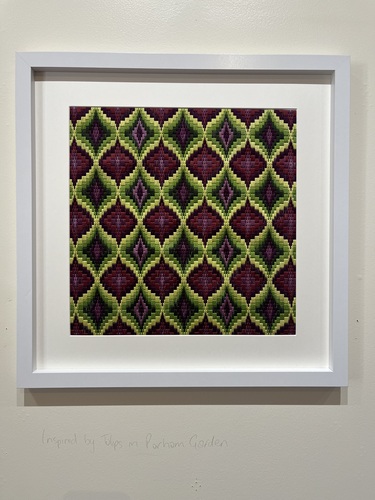 Framed Bargello needlework in purple and gold zigzag, inspired by tulips in Parham Garden