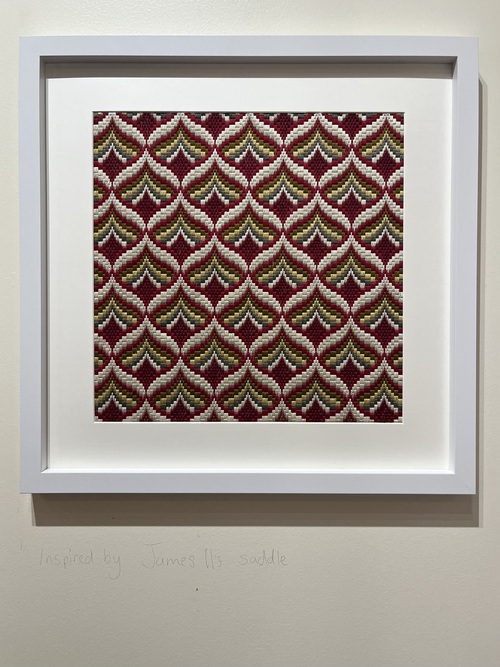 Framed Bargello needlework in deep red, gold and grey diamond pattern, inspired by James II's saddle