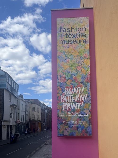 Pink banner for the Paint! Pattern! Print! exhibition outside the Fashion and Textile Museum