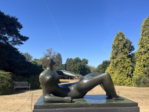 Henry Moore's bronze Reclining Figure sculpture on a stone plinth