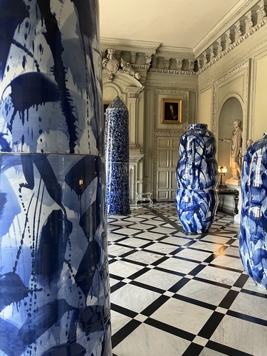 Large blue and white porcelain sculptures displayed in Petworth's Marble Hall