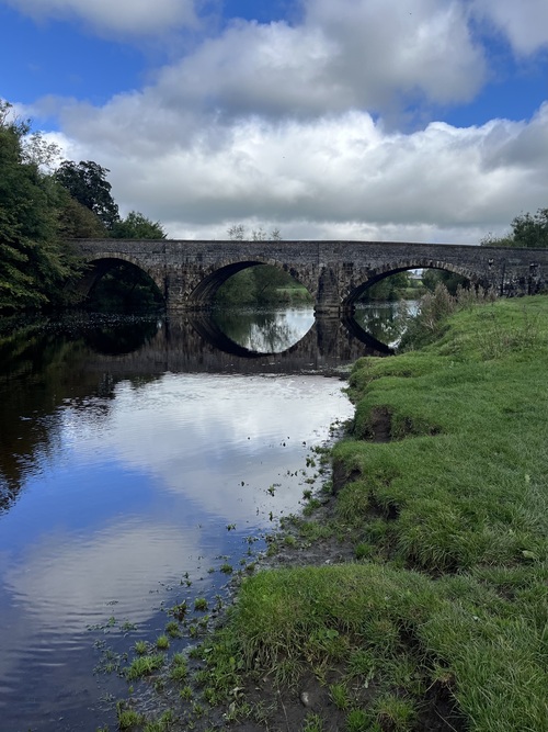 A bridge and its reflection in the river