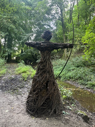 Willow sculpture of a figure with a bow and arrow