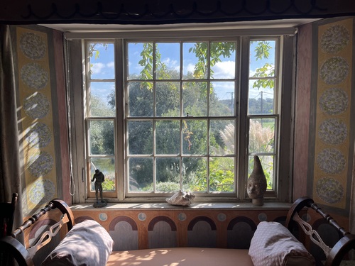 Window seat at Charleston with a shell and small sculpture on the sill, lovely light