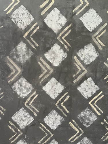 Painted wall decoration at Charleston, a dark ground with pale diamonds and chevrons