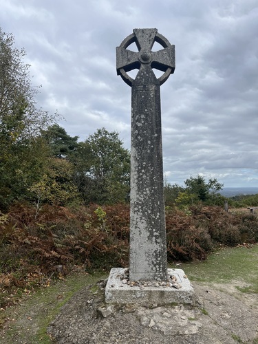 The Celtic Cross at the top of Gibbet Hill, with small stones left at its base