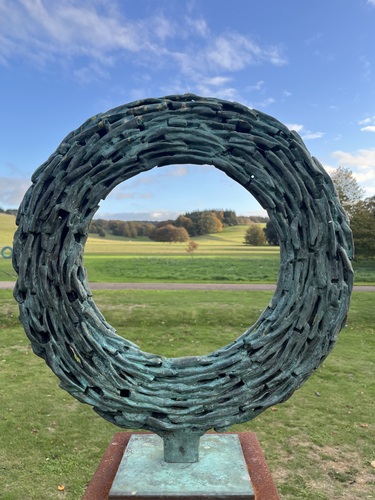Portal by James Wild with a view of the arboretum behind