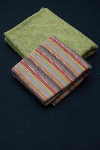 Green tweed and striped fabric