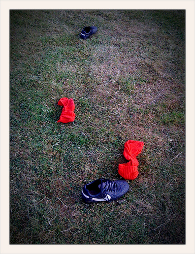 Found footwear: A pair of football boots and red socks