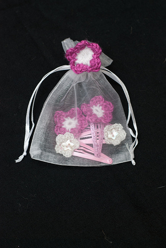 Flowery hair slides in gossamer bag