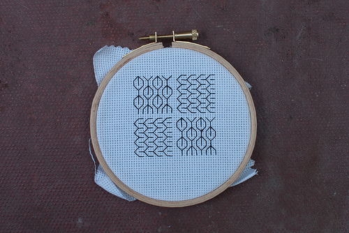 A blackwork Tulip and Open Zigzag sampler square