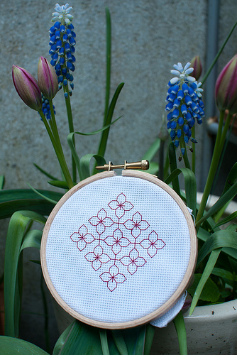 Blackwork in red. With garden flowers